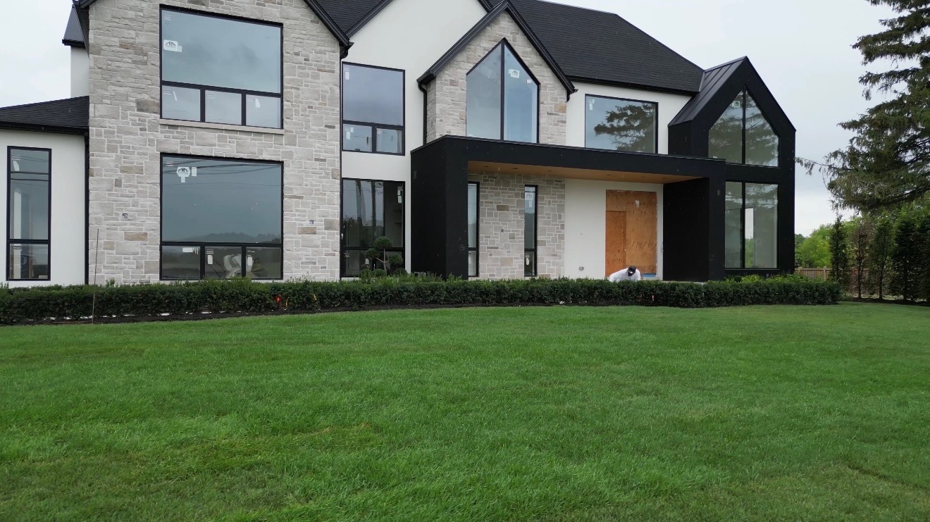 Luxury home with manicured lawn