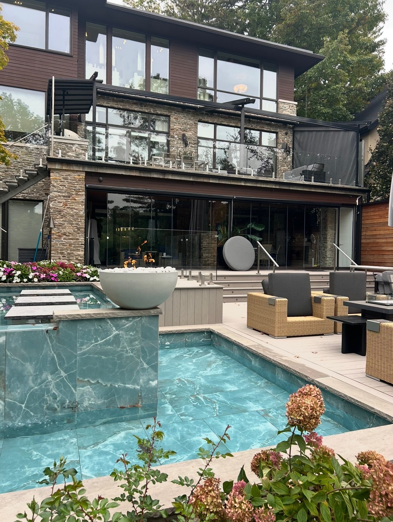 Pool with stone house and gardens