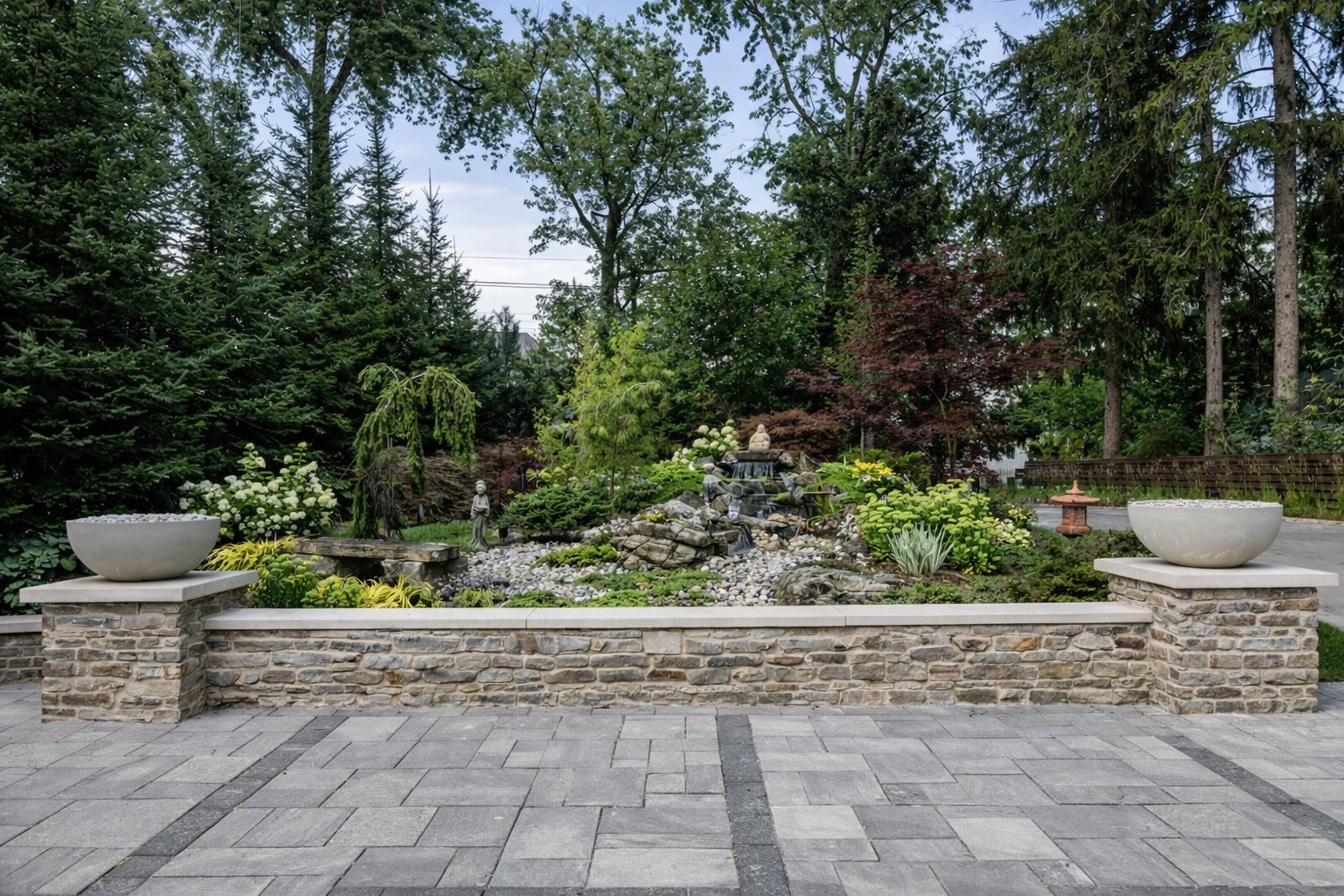 Stone patio with garden water feature